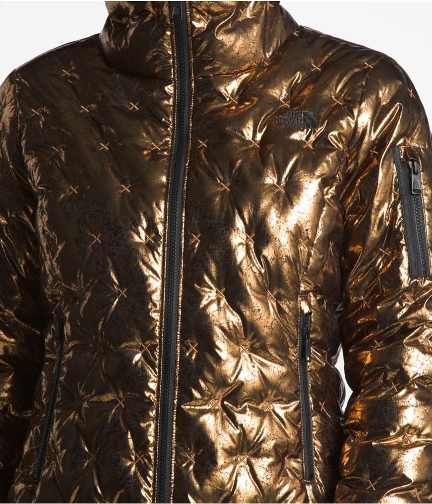 gold and black north face jacket