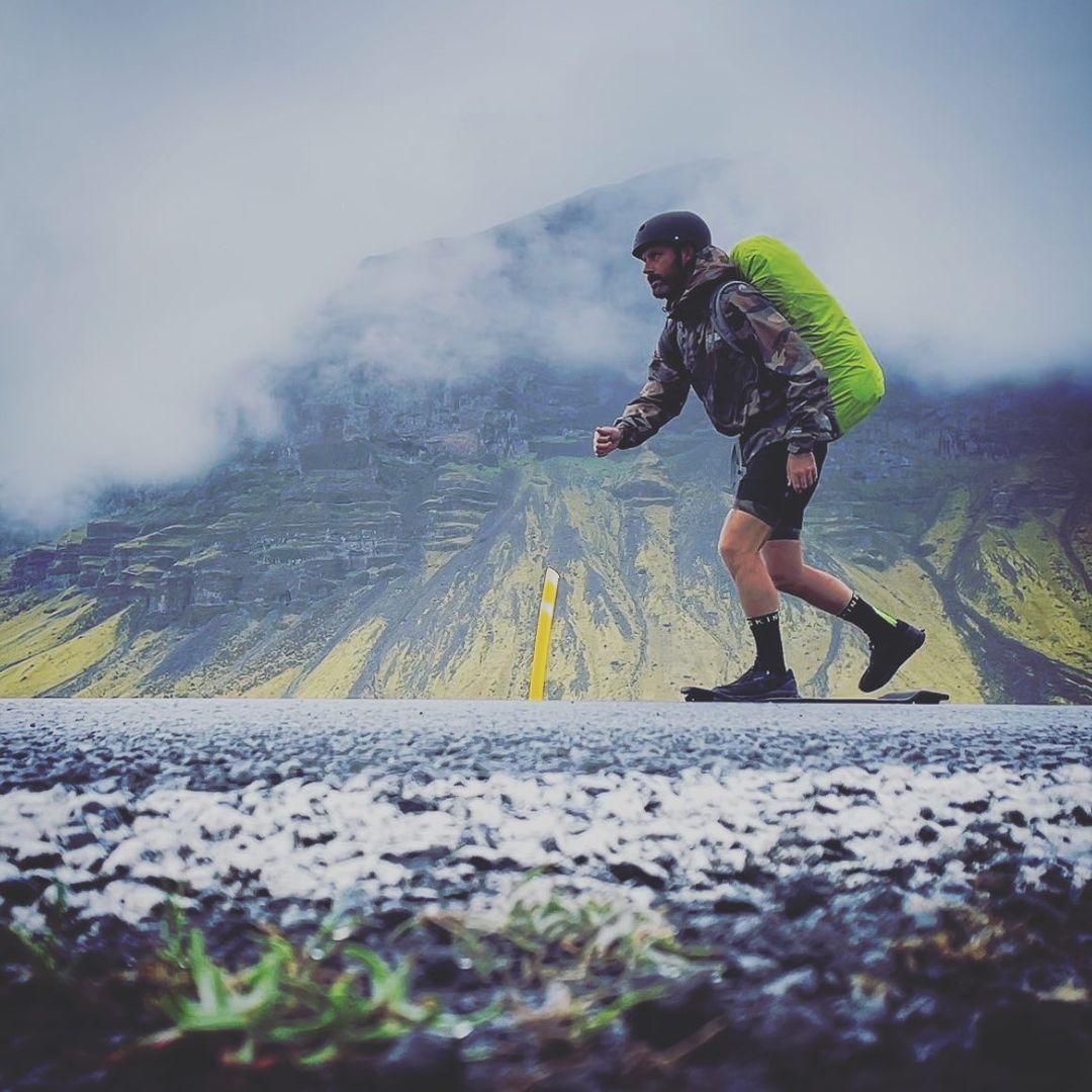 Duncan skating on a road in Iceland