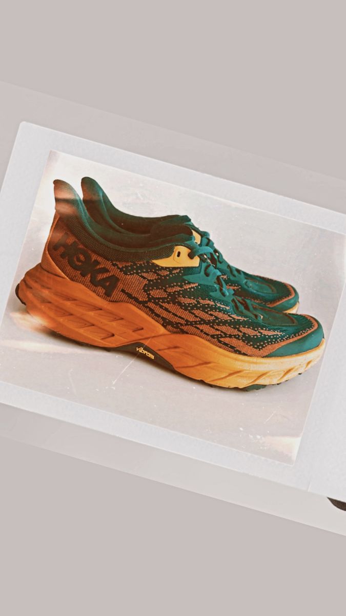 Hoka Speedgoat 5 trail running shoes in orange and blue