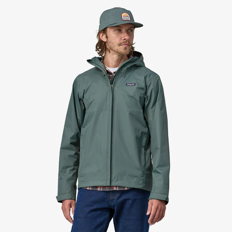 Person wearing Patagonia Torrentshell 3L Mens Waterproof Jacket - Nouveau Green