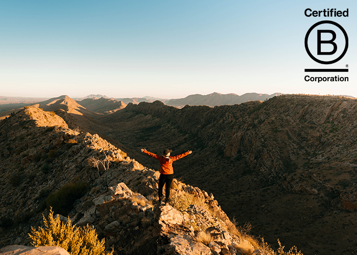 Woman standing on the Larapinta Trail with B Corp logo in the top right corner