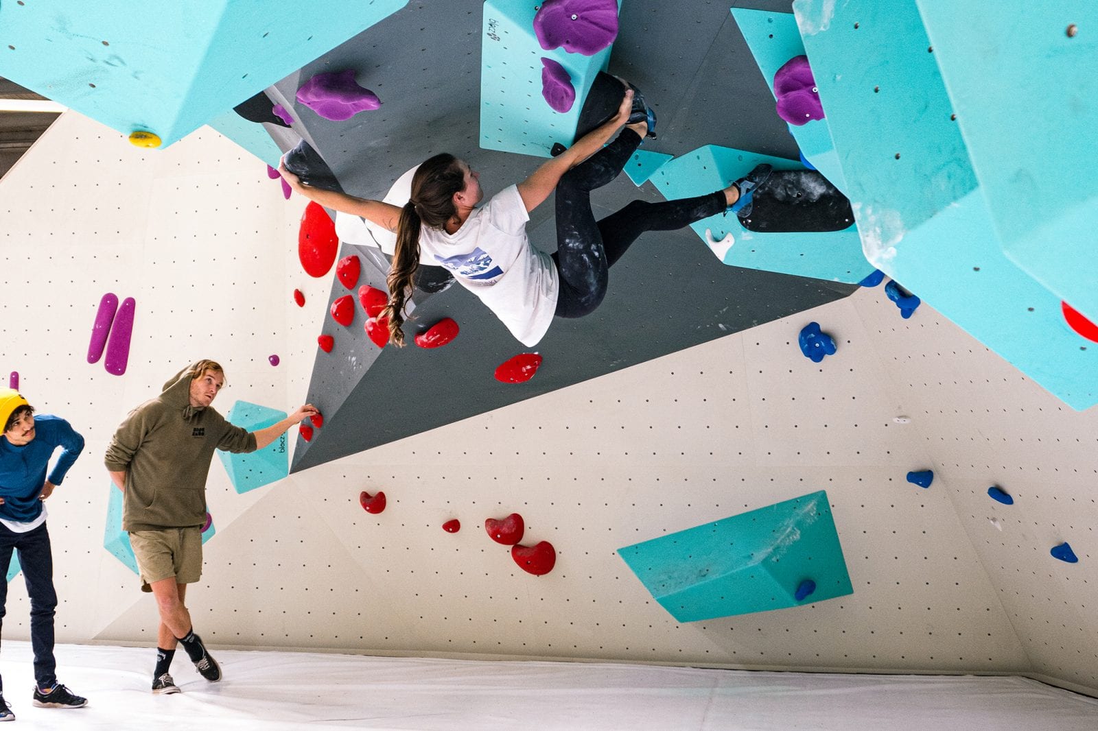 Person climbing on bouldering wall on an overhang