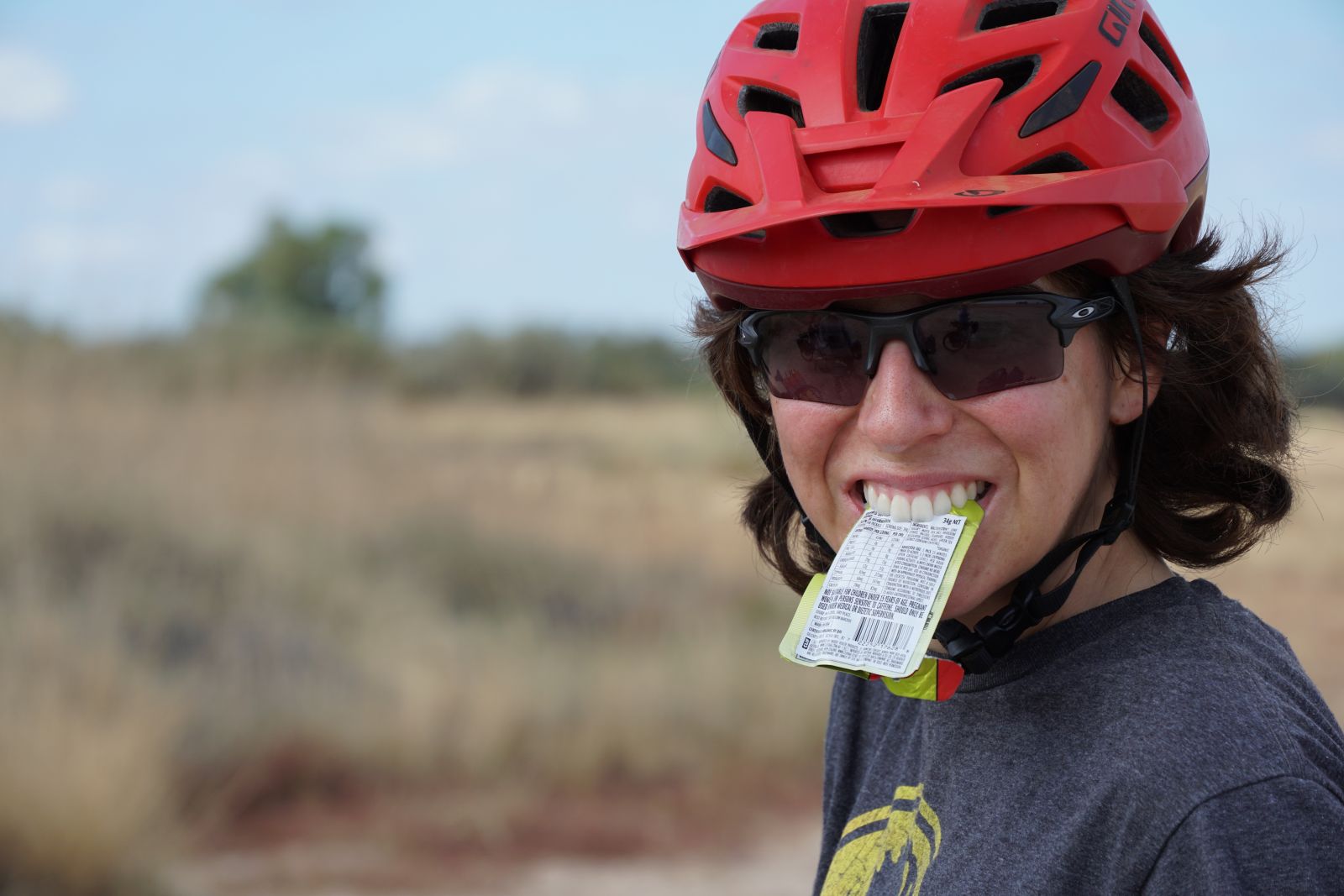 Person eating a snack on their bike