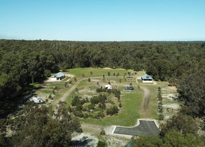 Overhead view of the entire campgrounds which are surrounded by trees