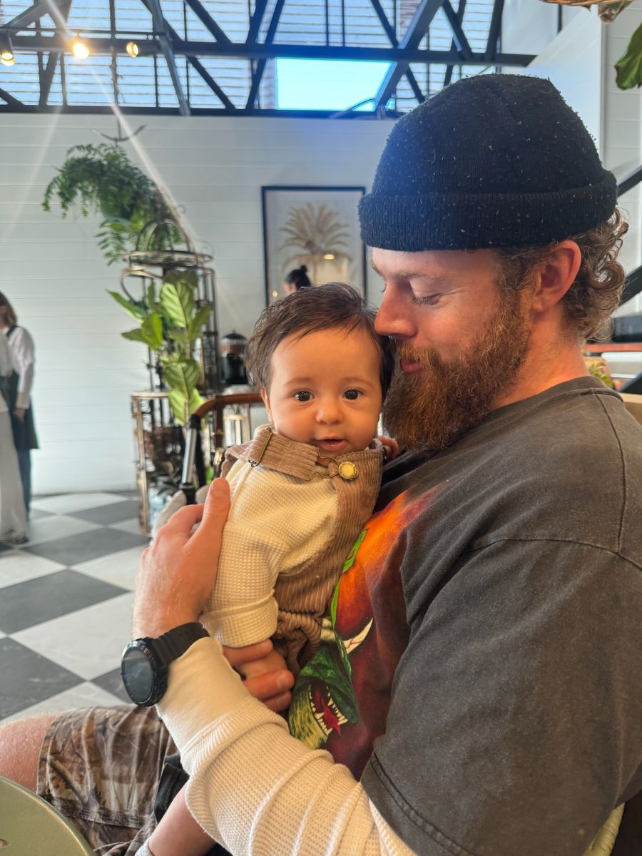 Adam, holding baby Archer.
