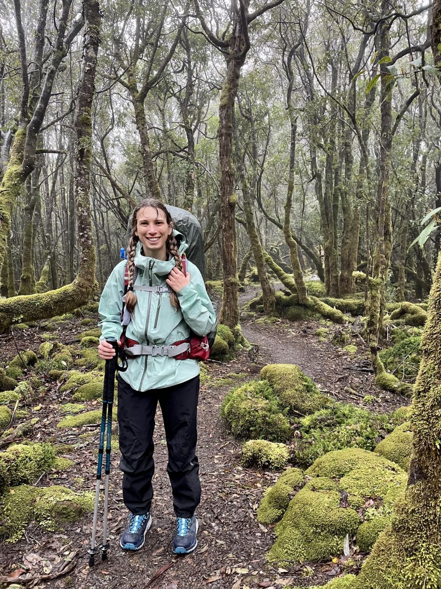 Jess wearing the Patagonia Calcite Waterproof Jacket in the rainy forest