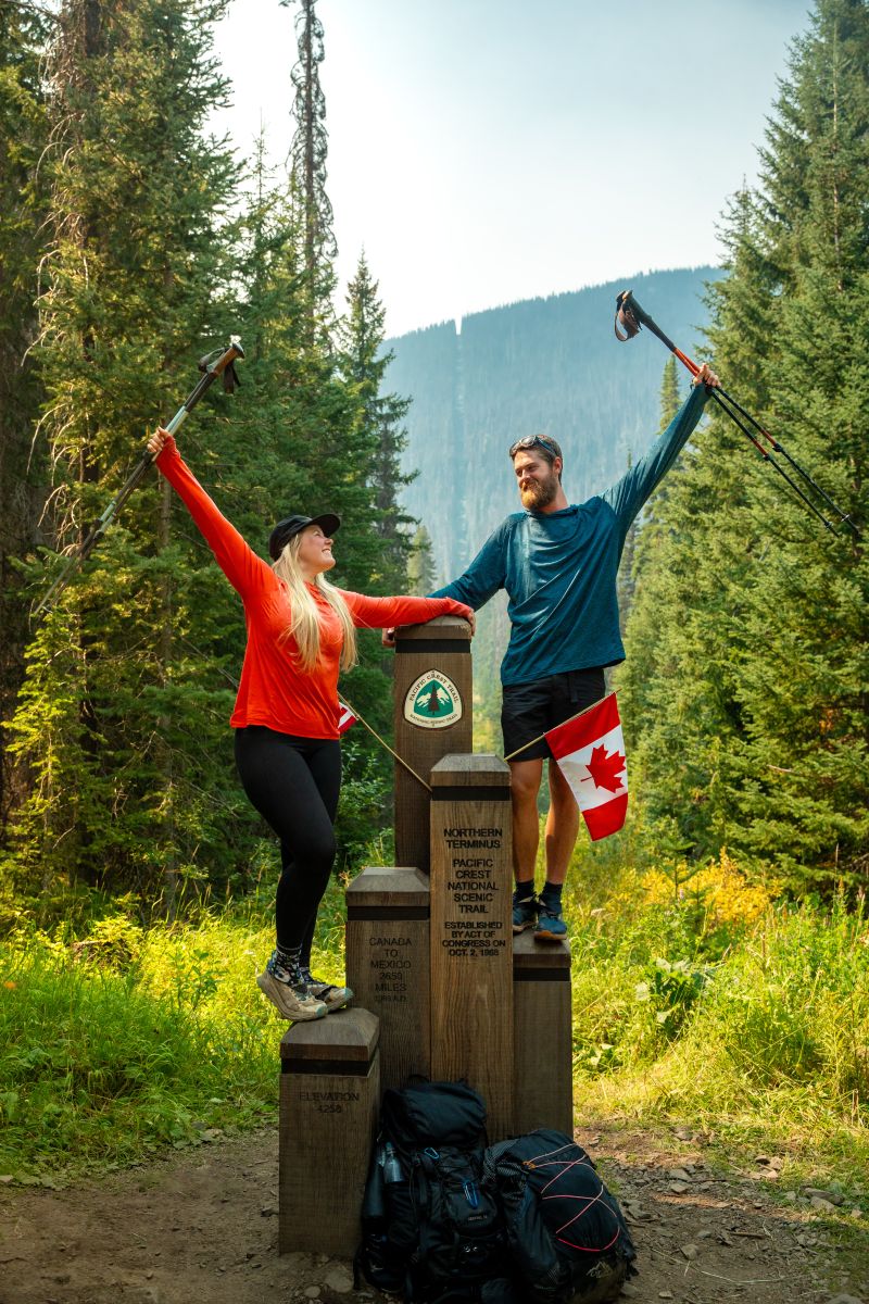 Jactina and Joel at the PCT finish point in Canada