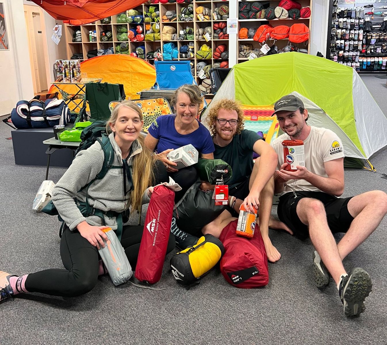 Me preparing gear with some of the Wild Earth team for a multi-day hike