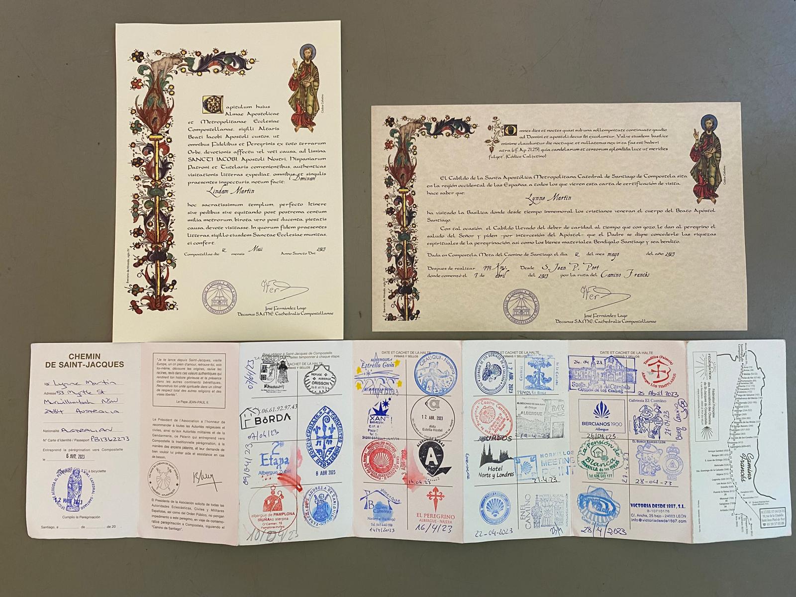 Camino de Santiago pilgrim passport credencial with stamps and official completion certificate