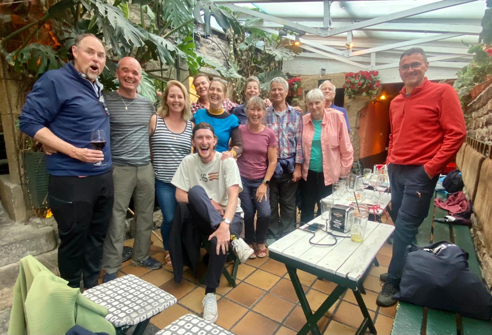 Pilgrims sharing a communal albergue meal on the Camino Frances stages