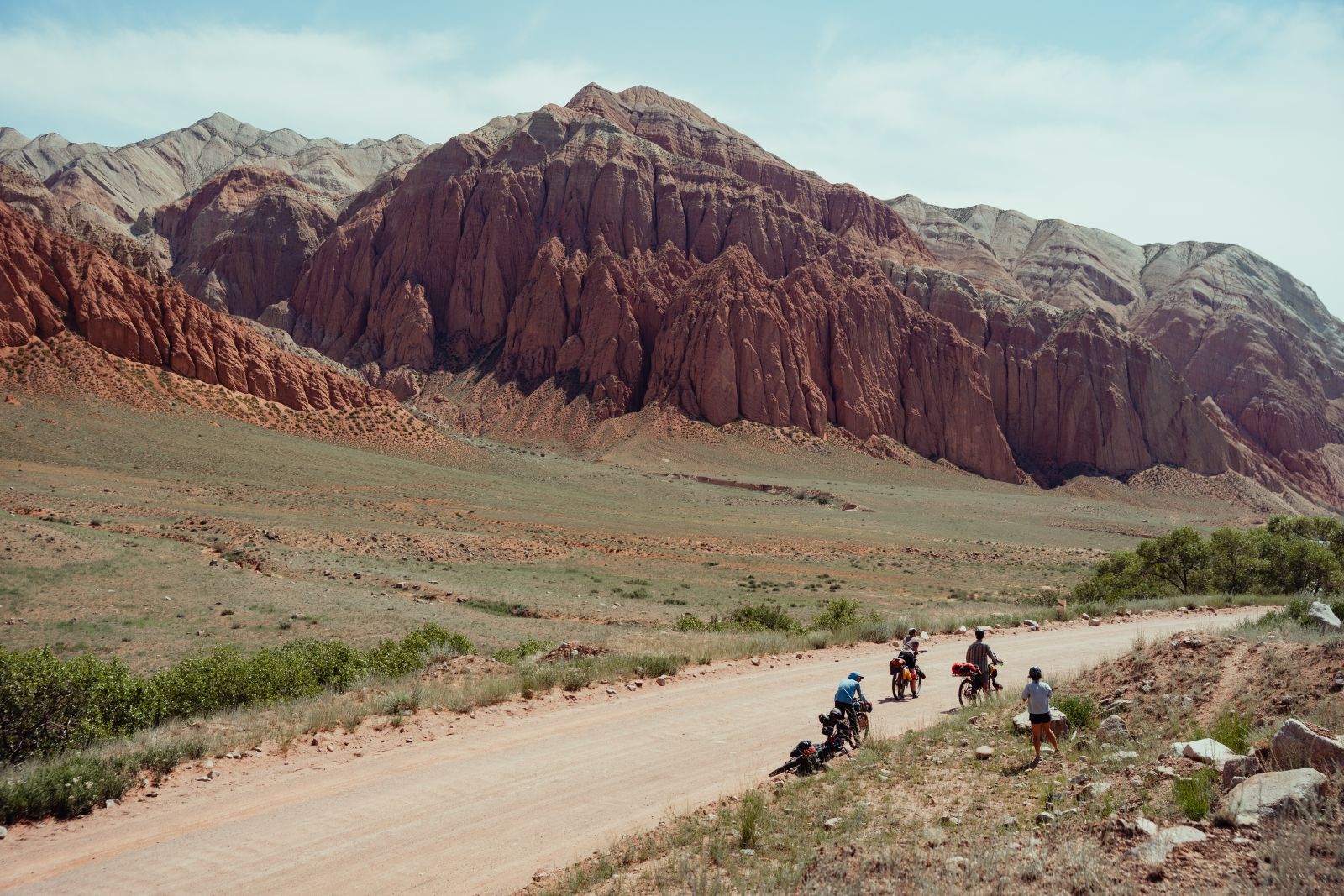 Photo of the crew bikepacking surrounded by mountains