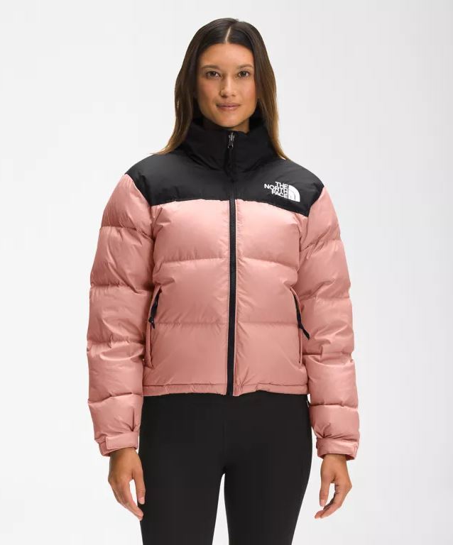 Woman wearing The North Face 1996 Retro Nuptse Womens Insulated Jacket in Rose Dawn