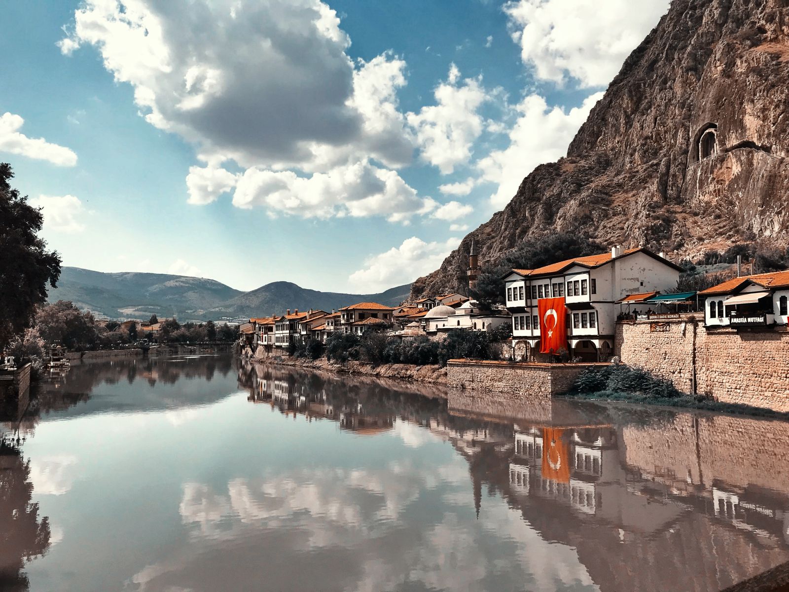 Small town in the mountains by a lake on the Carian Trail