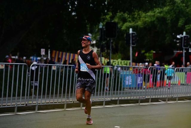 Anderson running in a racing event wearing black Wild Earth race singlet