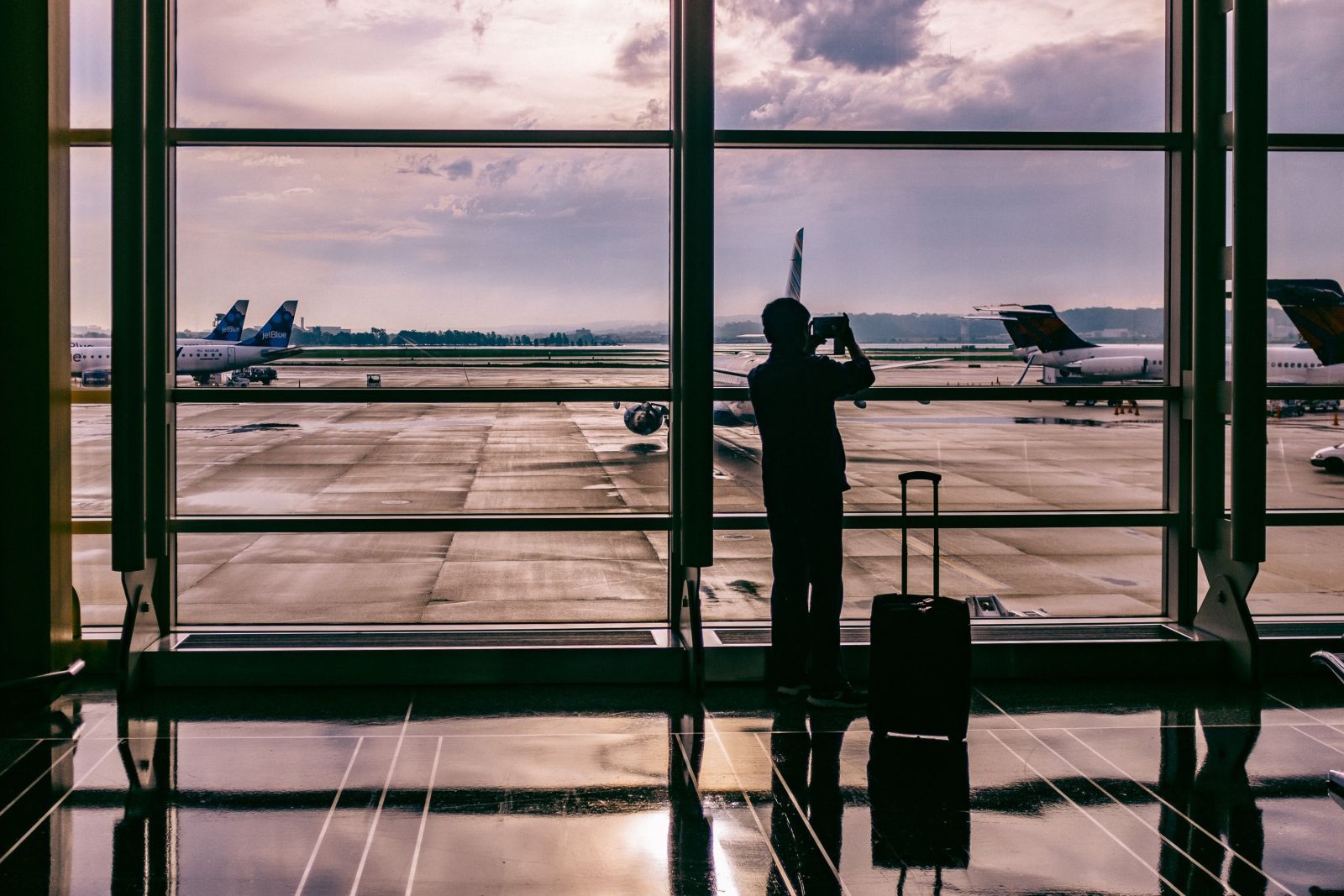 Ashim D Silva - man waiting at airport gate