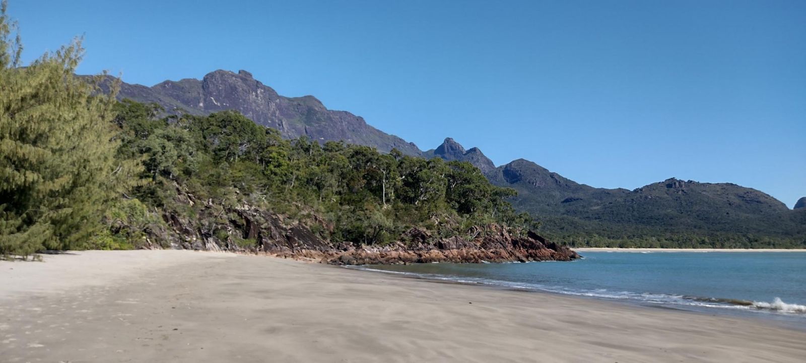 Beach with mountains in the background