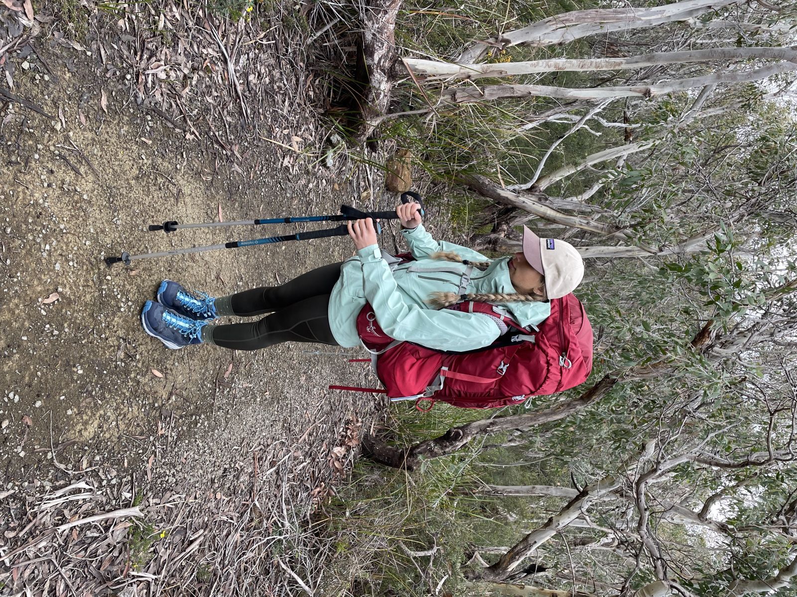 Jess wearing the Osprey Aura 65L Womens Hiking Pack in Red