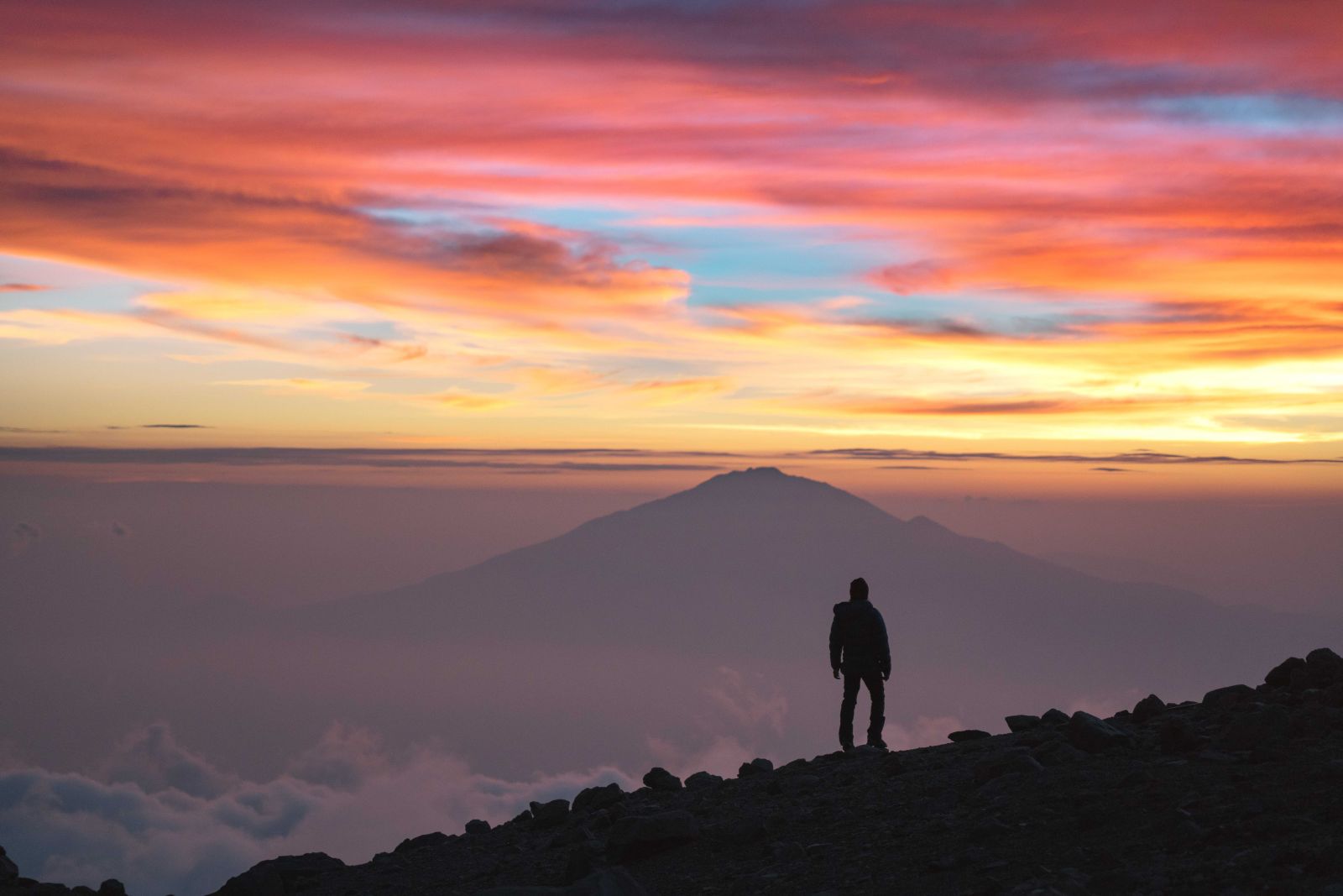 Jackson at the peak of Kilimanjaro at sunrise
